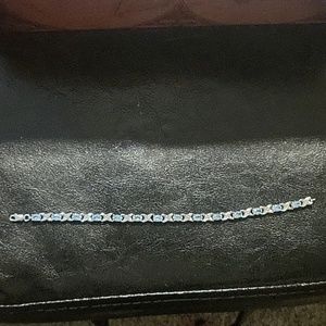 Blue topaz and Diamond Hugs and Kisses Bracelet